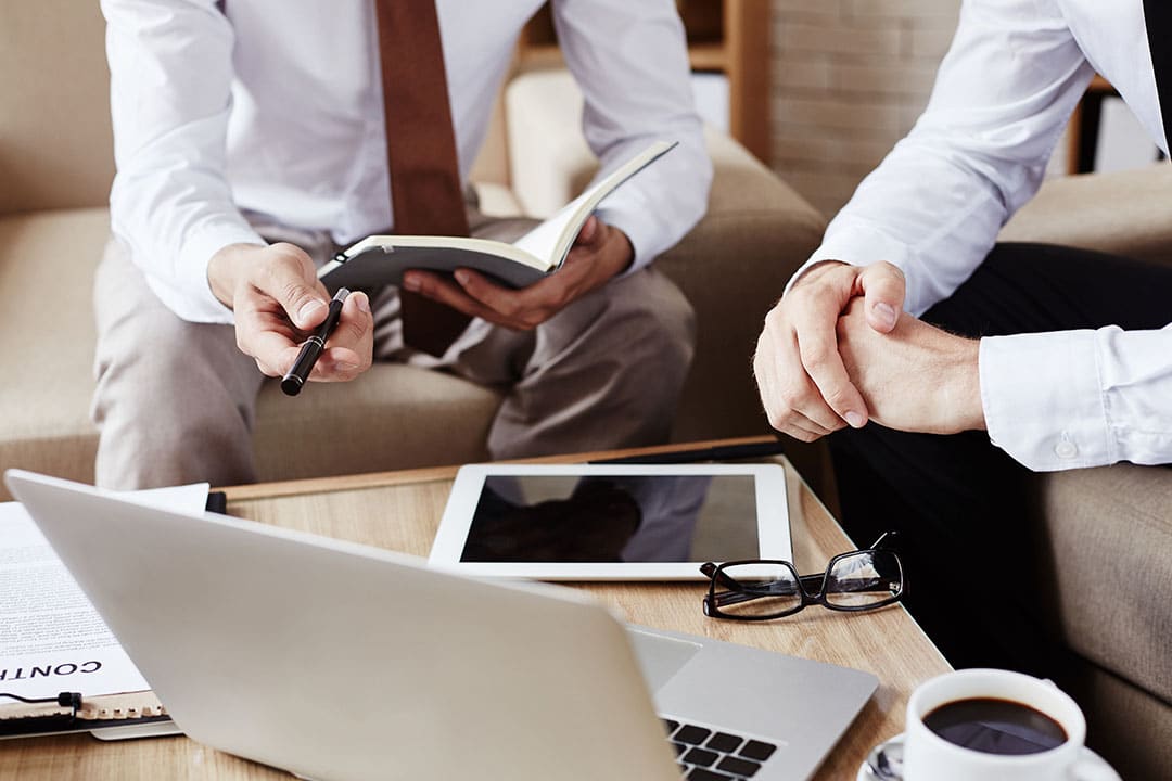 People using devices to communicate